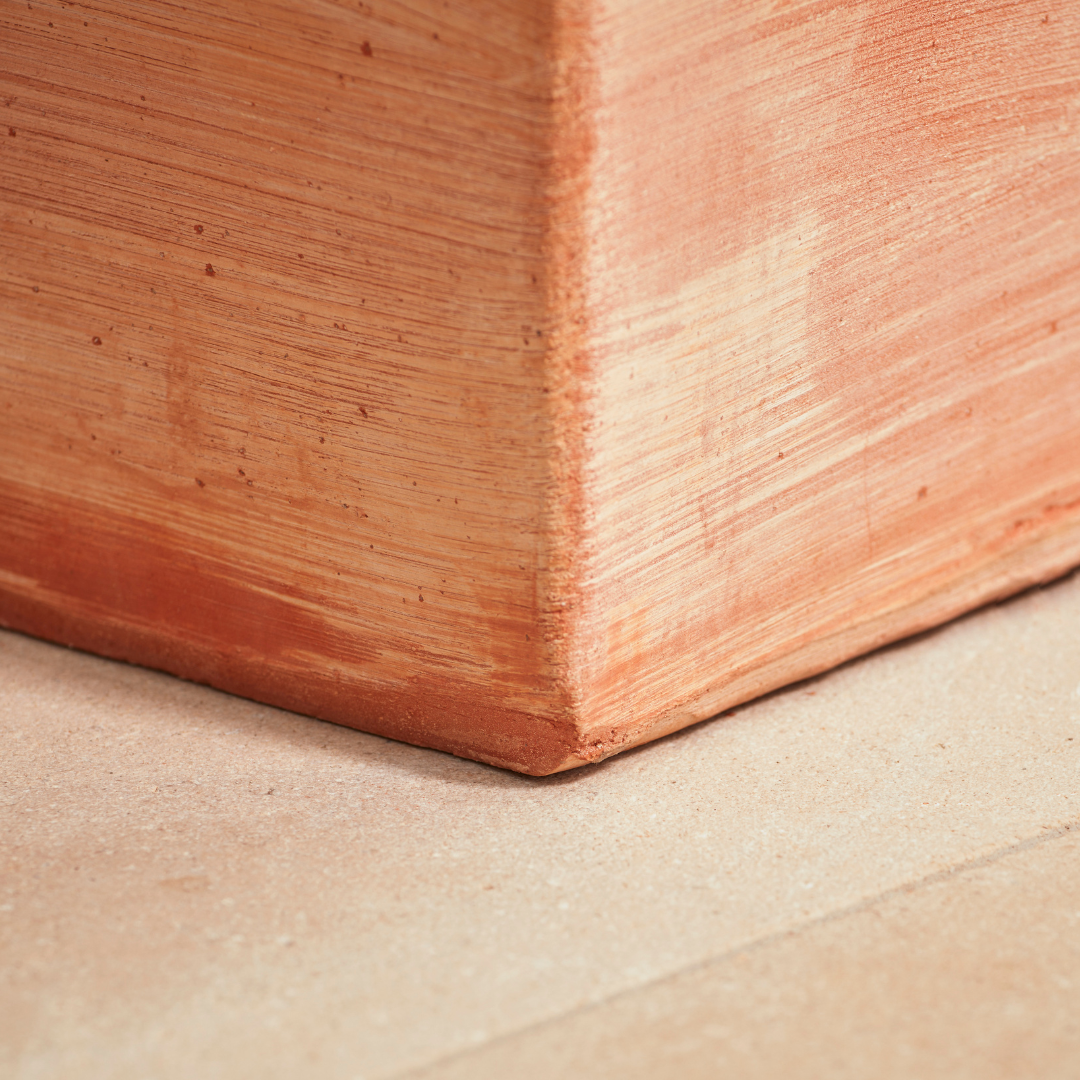 Base of the Sardinia Tall Square Tapered Terracotta Pot, showing its sturdy structure and kiln-fired terracotta material. A frost-proof and weather-resistant planter for gardens and terraces.