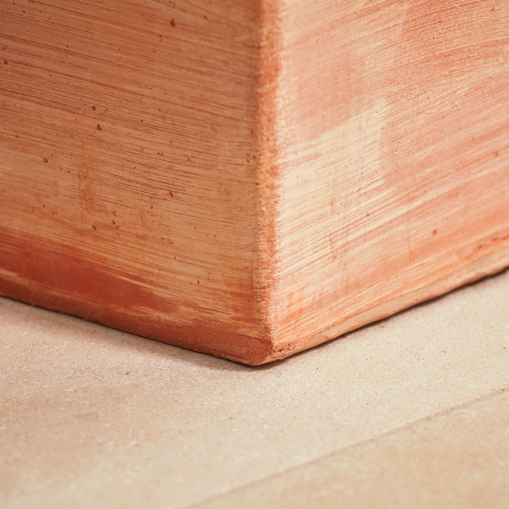 Base of the Sardinia Tall Square Tapered Terracotta Pot, showing its sturdy structure and kiln-fired terracotta material. A frost-proof and weather-resistant planter for gardens and terraces.