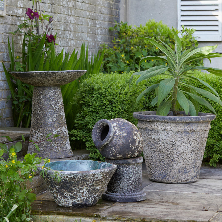 Ancient Salt Glaze Bird Bath styled with coordinating aged planters, creating a rustic, nature-inspired outdoor setting.