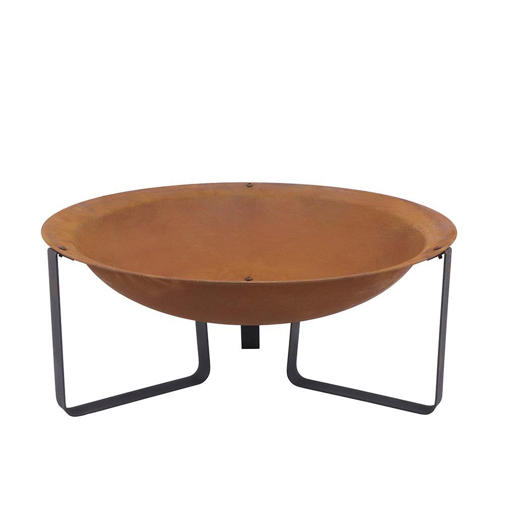 A standalone image of the rust-effect fire pit against a white background, showcasing its wide steel bowl and sturdy black metal legs.
