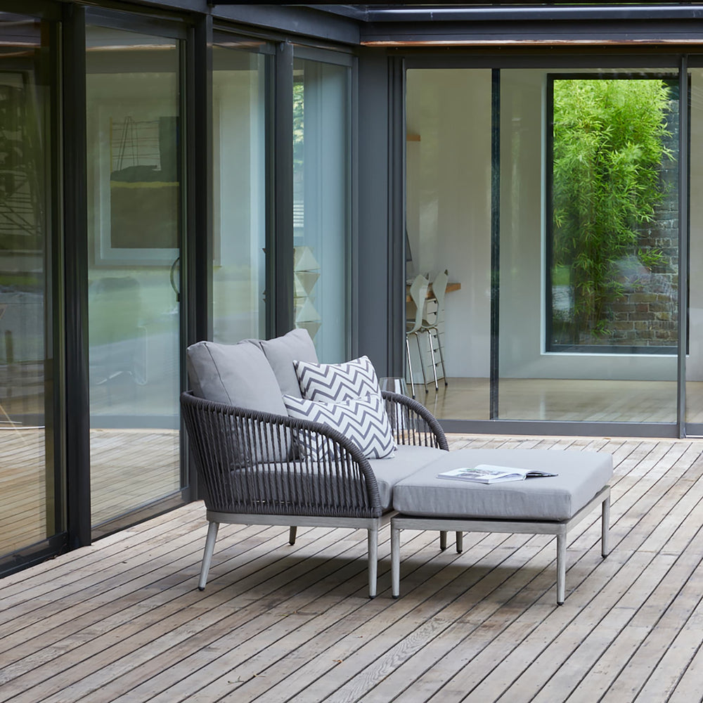 Richmond garden sofa and armchair with deep grey cushions and woven rope detailing, designed for elegant and comfortable outdoor seating.