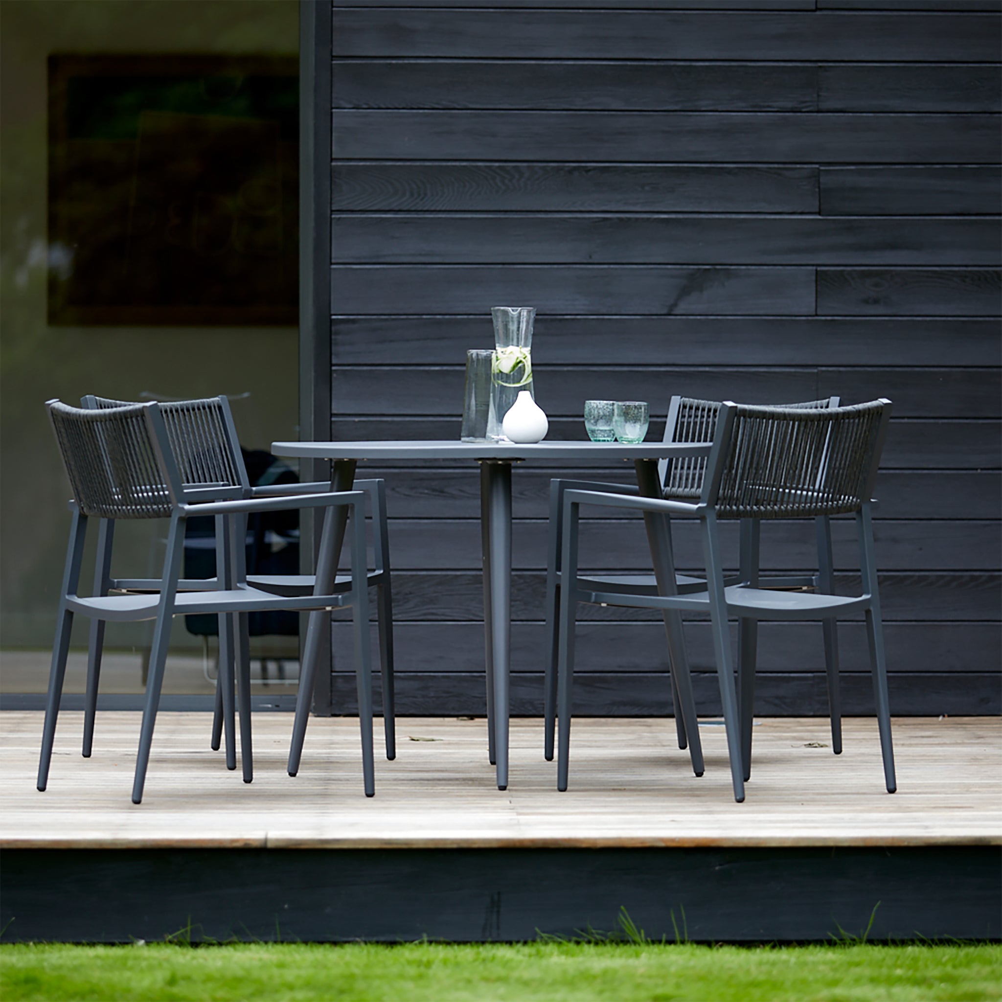 Close-up of the Richmond garden dining table with a sleek, powder-coated aluminium frame and minimalist design.